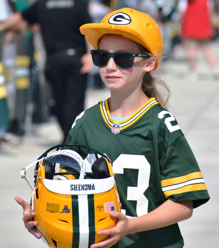 This young fan was happy carrying a helmet.