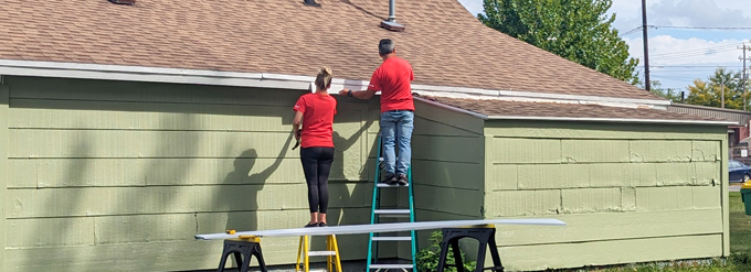 Volunteers fixing a house