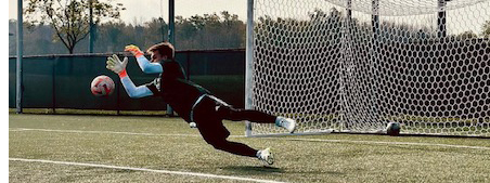 Soccer player making a goal save