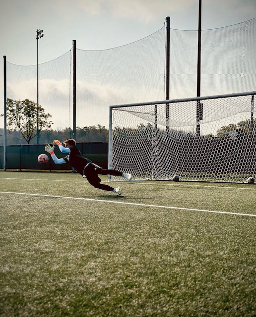 Soccer player making a goal save