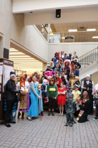 A group of cosplayers posing on stairs