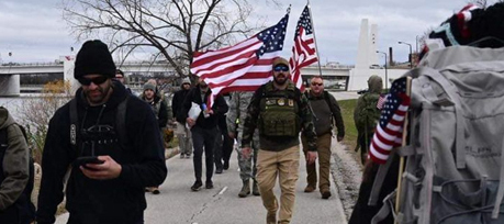 Participants from the 10th annual Veterans Awareness March walk along the trail alongside other veterans and community members. Submitted photo
