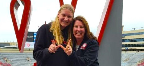 Ashwaubenon High School junior Berritt Herr, left, stands with University of Wisconsin-Madison softball coach Yvette Healy. Herr recently verbally committed to the play at Wisconsin. Submitted Photo