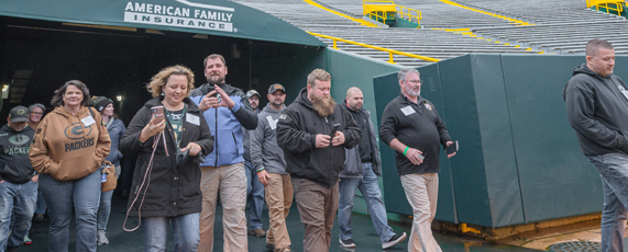 Veterans exit the players tunnel onto Lambeau Field.