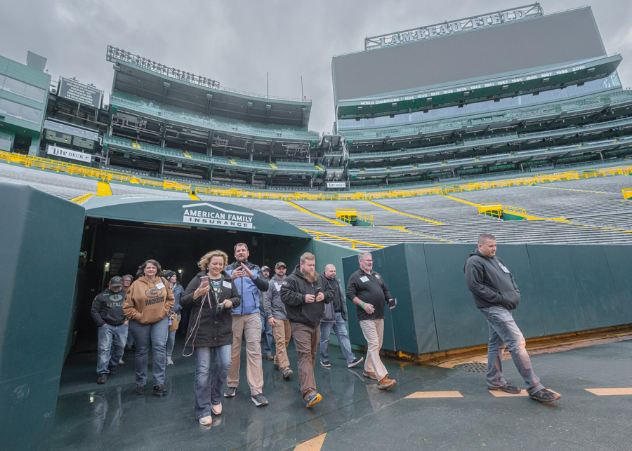 Veterans exit the players tunnel onto Lambeau Field.