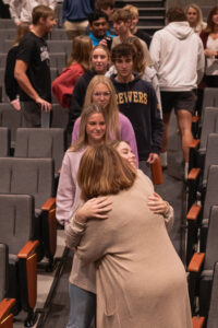 West De Pere students line up to congratulate Boyd with hugs.