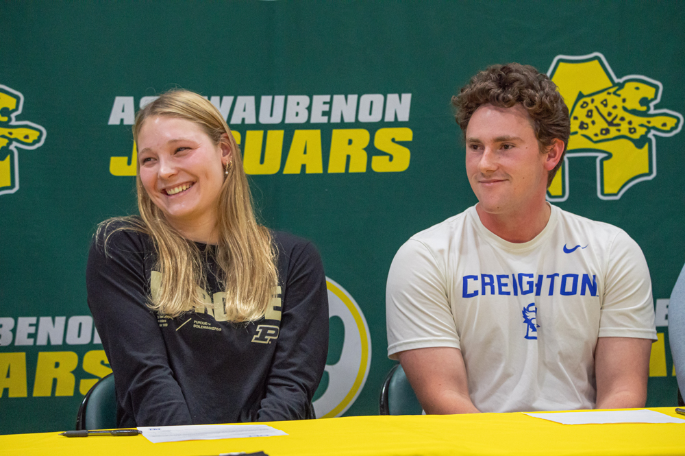 From left, Sienna Nitke and Eason Hurd sign National Letters of Intent to continue their academic and athletic careers at the college level. Nitke, a swimmer, committed to Purdue, while Hurd will attend Creighton and play baseball. Shane Fitzsimmons photo