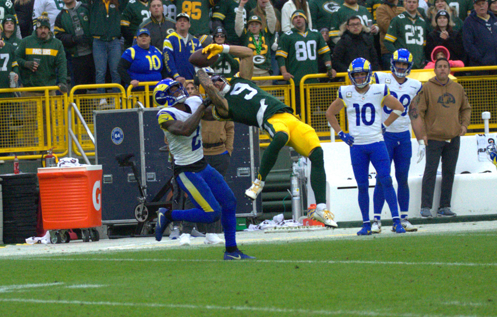 Green Bay Packers Wide Reciever Christian Watson makes a tremendous effort for a reception in their game against the Los Angeles Rams. Tori Wittenbrock photo