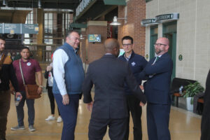 Kansas City Mayor Quinton Lucas, back to camera, talks with NFL Draft organizers Discover Green Bay President/CEO Brad Toll, at Lucas' left; Green Bay Packers Public Affairs Director Aaron Popkey; and Green Bay Mayor Eric Genrich. Kris Leonhardt photo