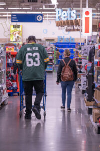 Packers Offensive Tackle Rasheed Walker shops with Pals program participants on Dec. 5.