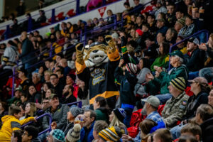 Green Bay Gamblers mascot, bobcat Ace engages with the crowd 