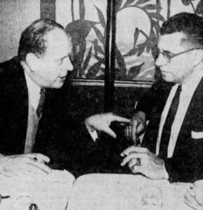 Green Bay Packers Board Director Dick Bourguignon talks privately with new head coach, Vince Lombardi, at the Hotel Northland in February 1959