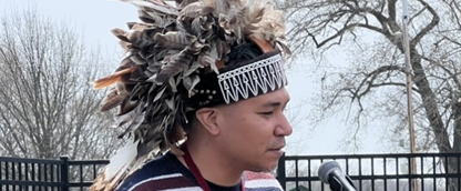 James Flores opened the story of the Peace Tree by speaking in Onyota’a:ká, the native language of the Oneida Nation, while the Menominee Indian High School Skud Nation Drum Group played