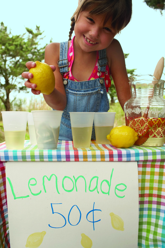 Stock photo of a child at a lemonade stand